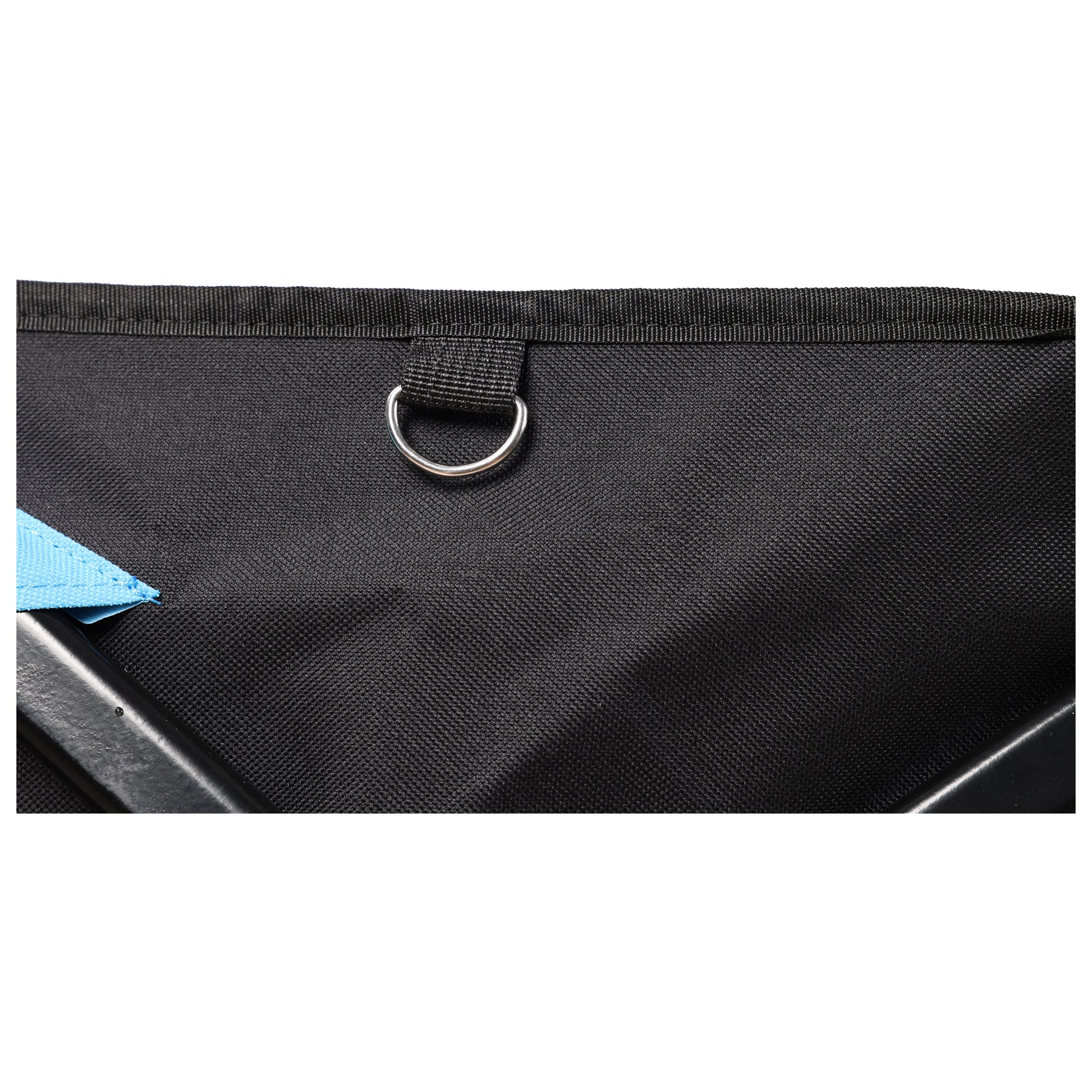 Closeup of a black canvas bag with a metal Dring and blue accent strap