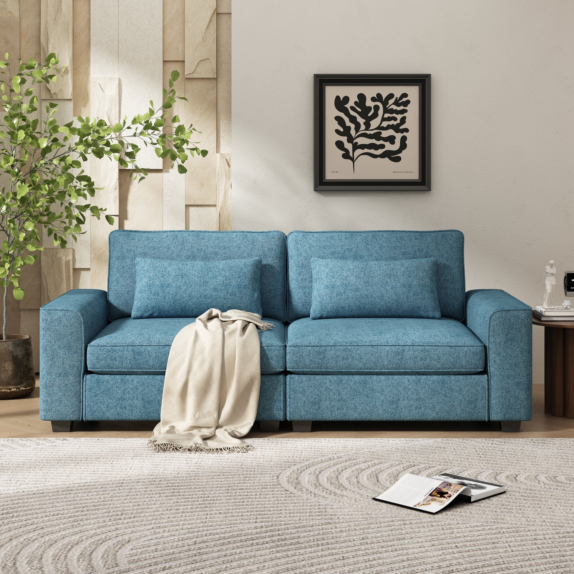 Blue textured fabric sofa with minimalist design and throw blanket