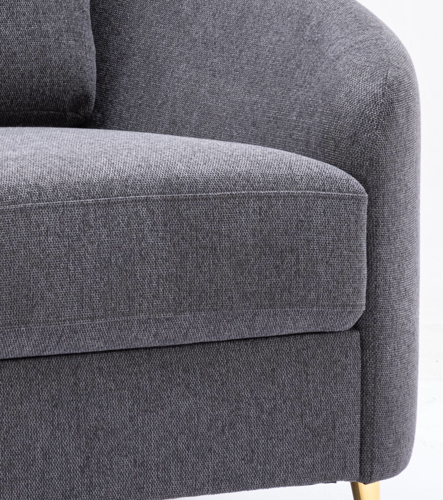 Closeup of dark grey fabric armchair seat cushion with textured weave