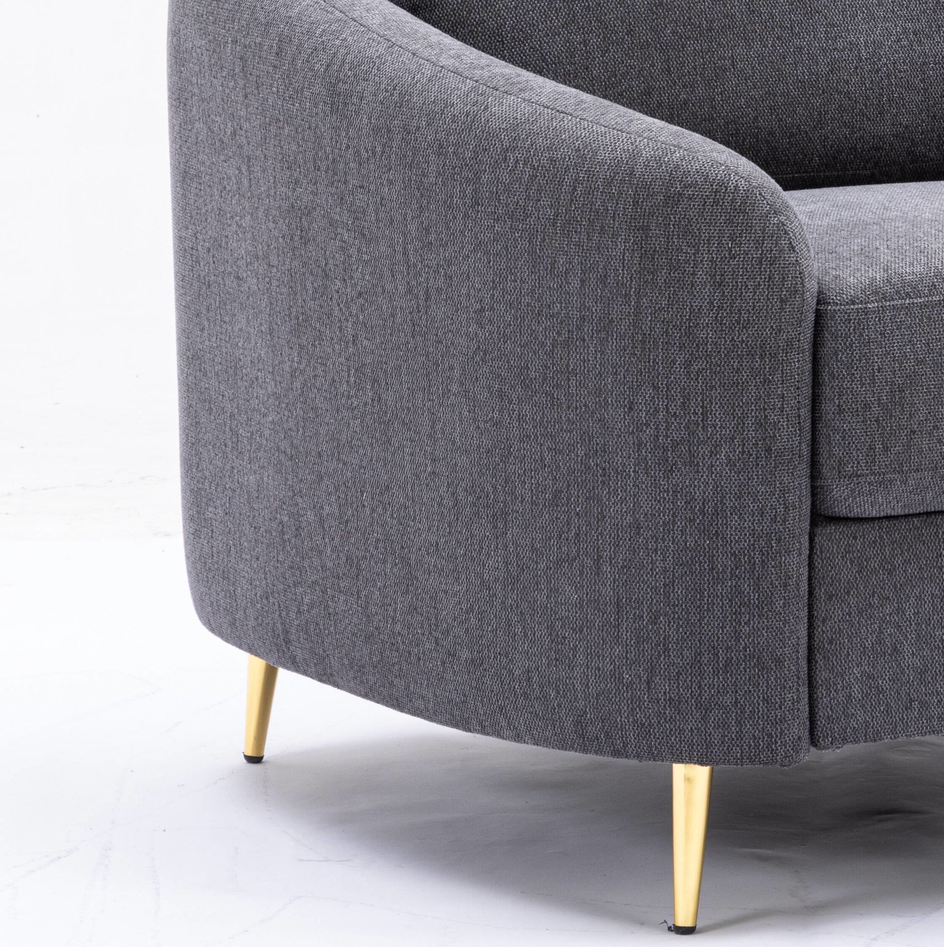 Modern charcoal grey fabric armchair with tapered gold legs