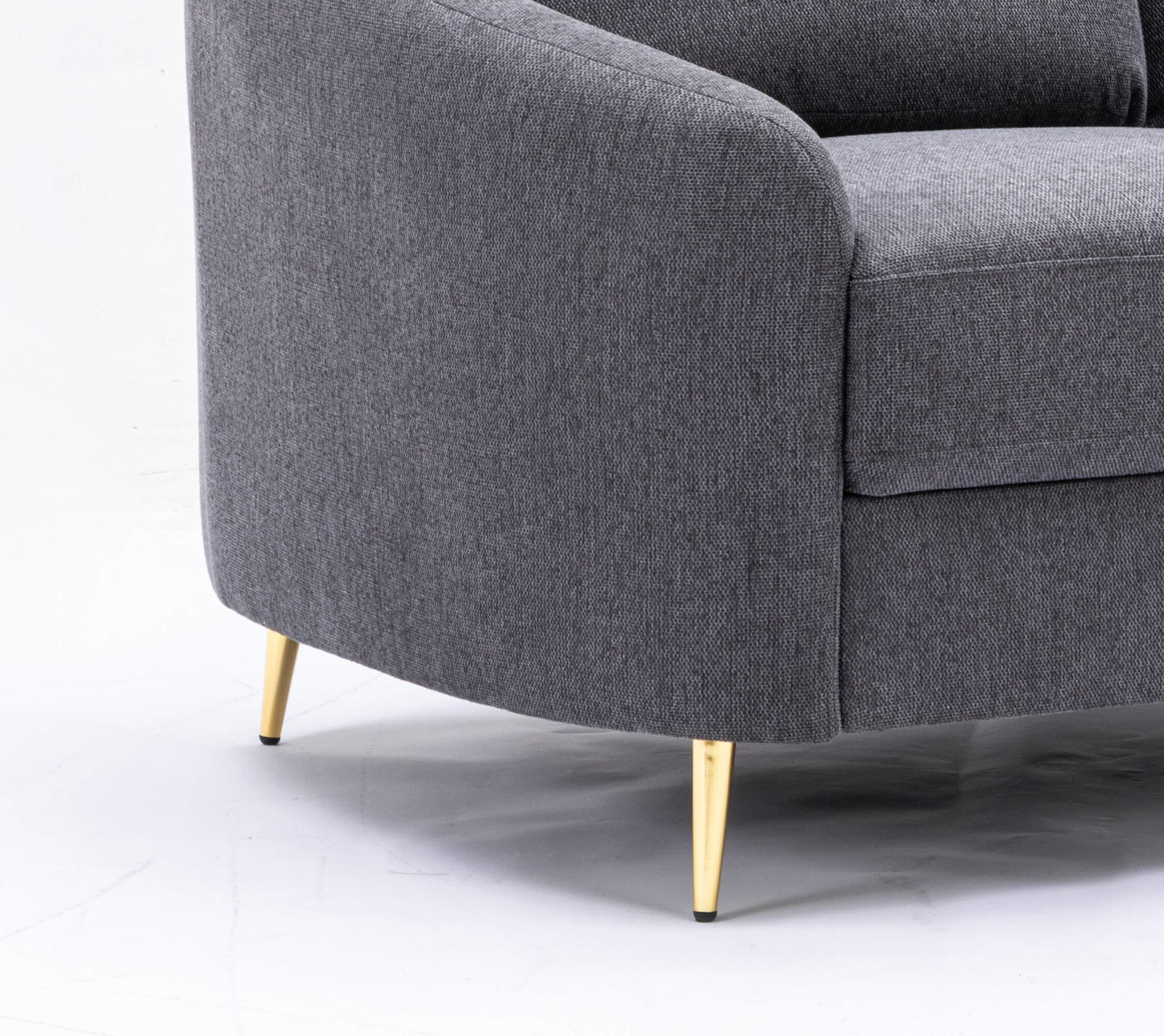 Modern grey fabric armchair with tapered gold legs