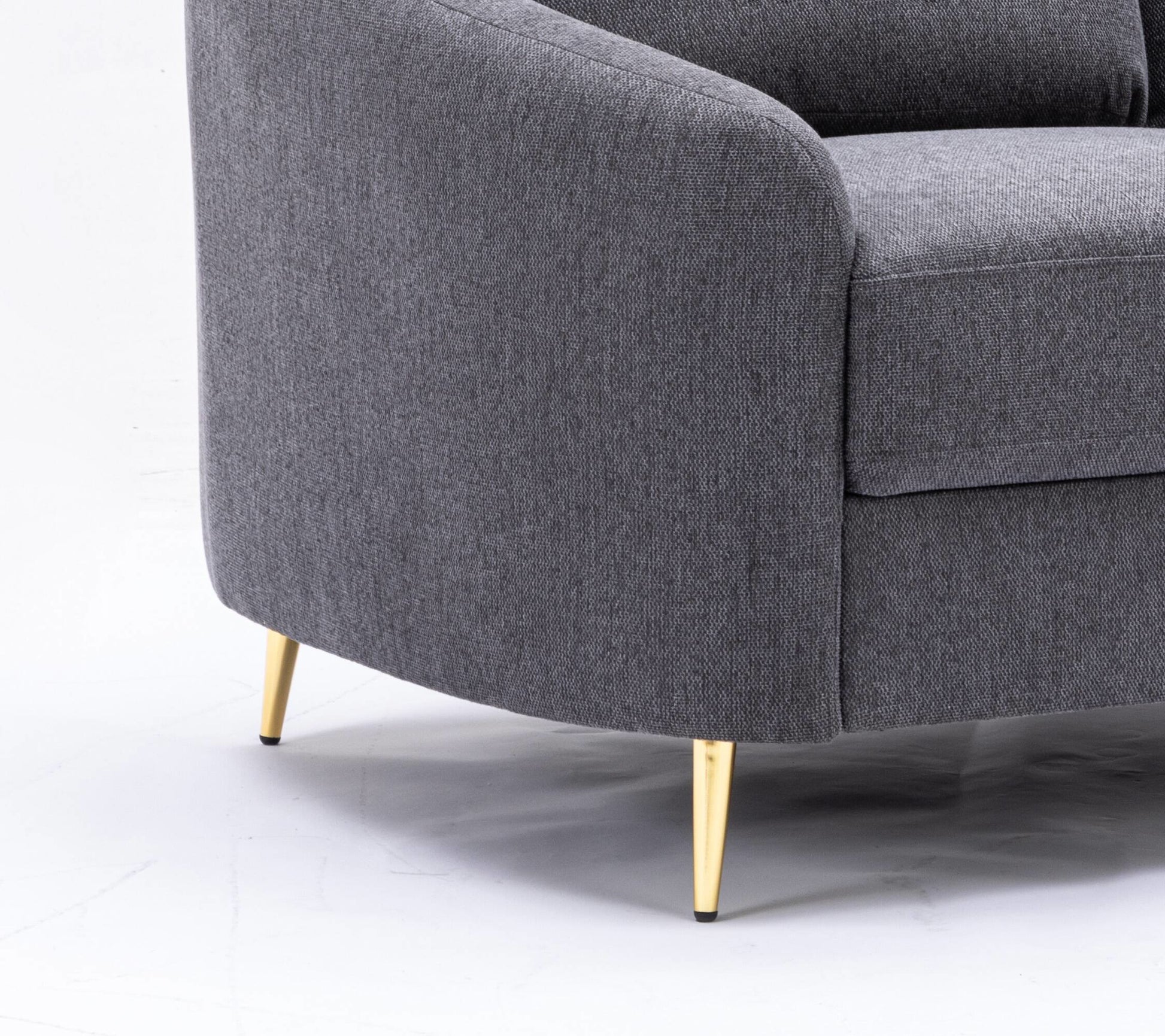 Modern grey fabric armchair with tapered gold legs