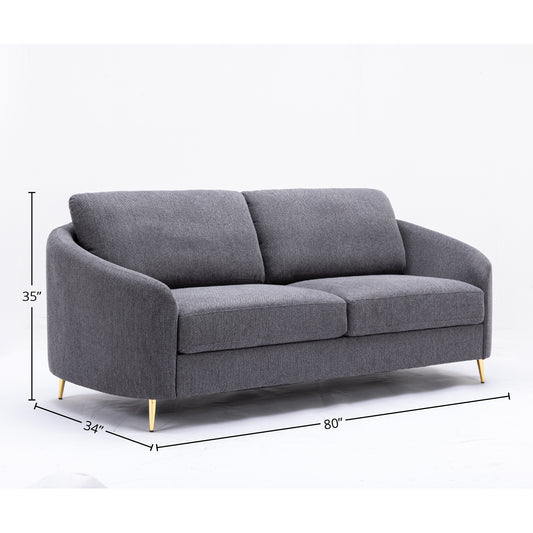 Modern gray fabric sofa with curved arms and gold metal legs  inches wide