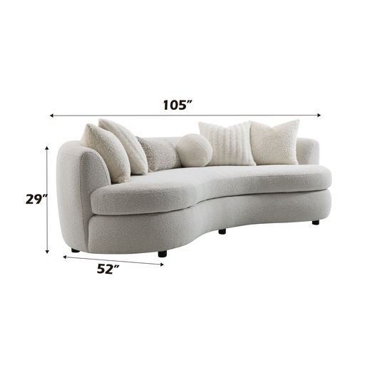 Cream boucle curved sofa with plush pillows perfect for a modern living room