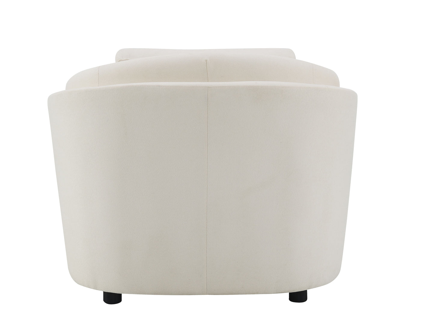 Back view of a cream velvet armchair with rounded silhouette and black cylindrical legs