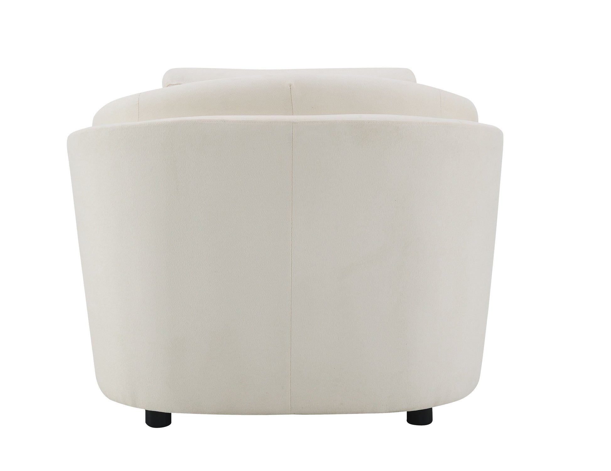 Back view of a cream velvet armchair with rounded silhouette and black cylindrical legs