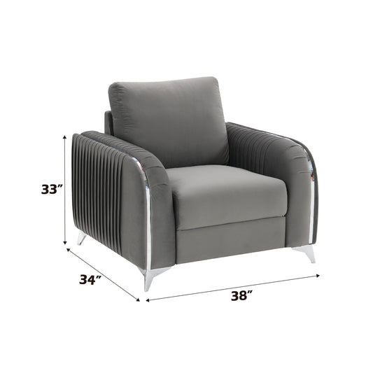 Gray velvet accent chair with pleated arms and chrome trim