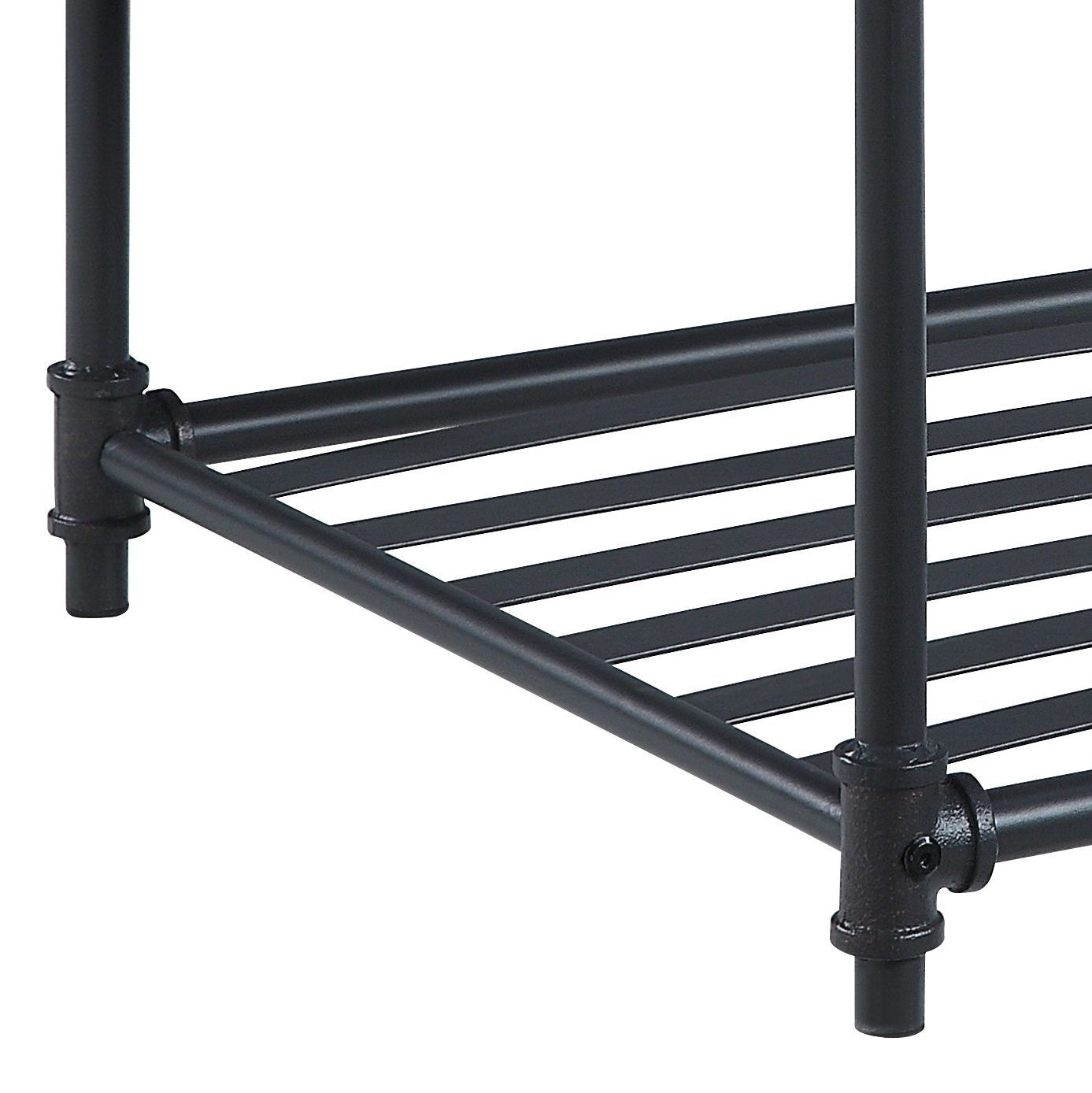 Closeup of industrial pipe shelf legs and black metal slatted shelf