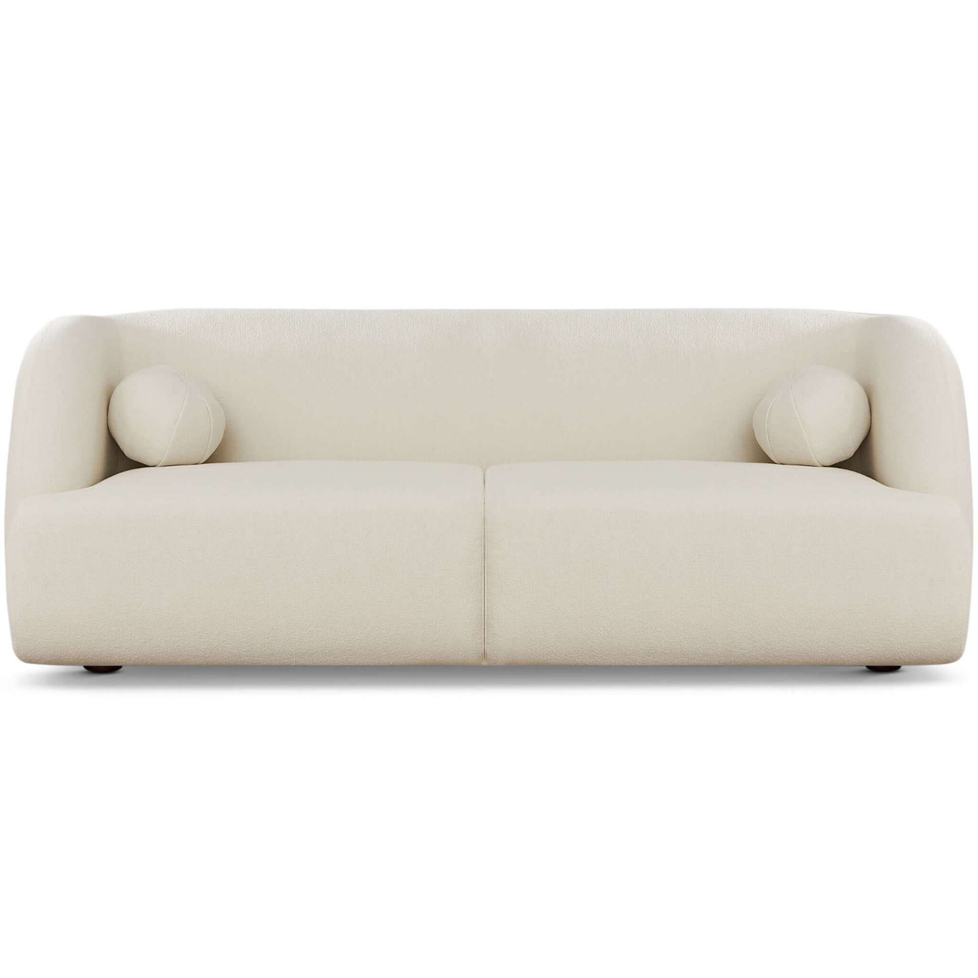 Cream boucle fabric sofa with rounded arms and two circular accent pillows