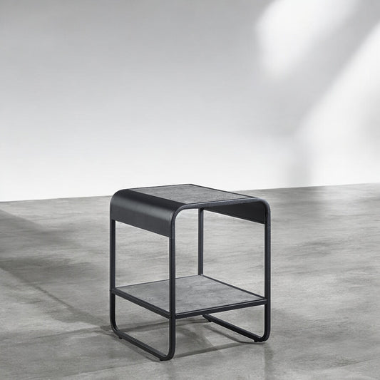 Modern black metal side table with grey faux concrete top and shelf