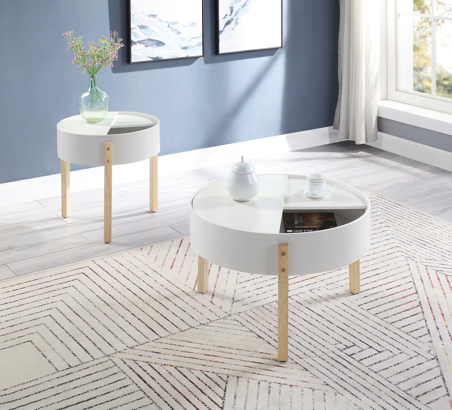 Modern white round coffee table with angled wooden legs and storage compartments perfect for living rooms