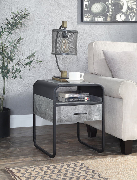 Modern industrial side table with black metal frame and concretelook drawer