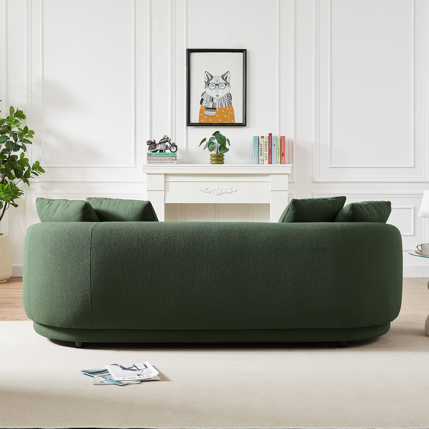 Dark green boucle sofa with rounded modern design and plush cushions