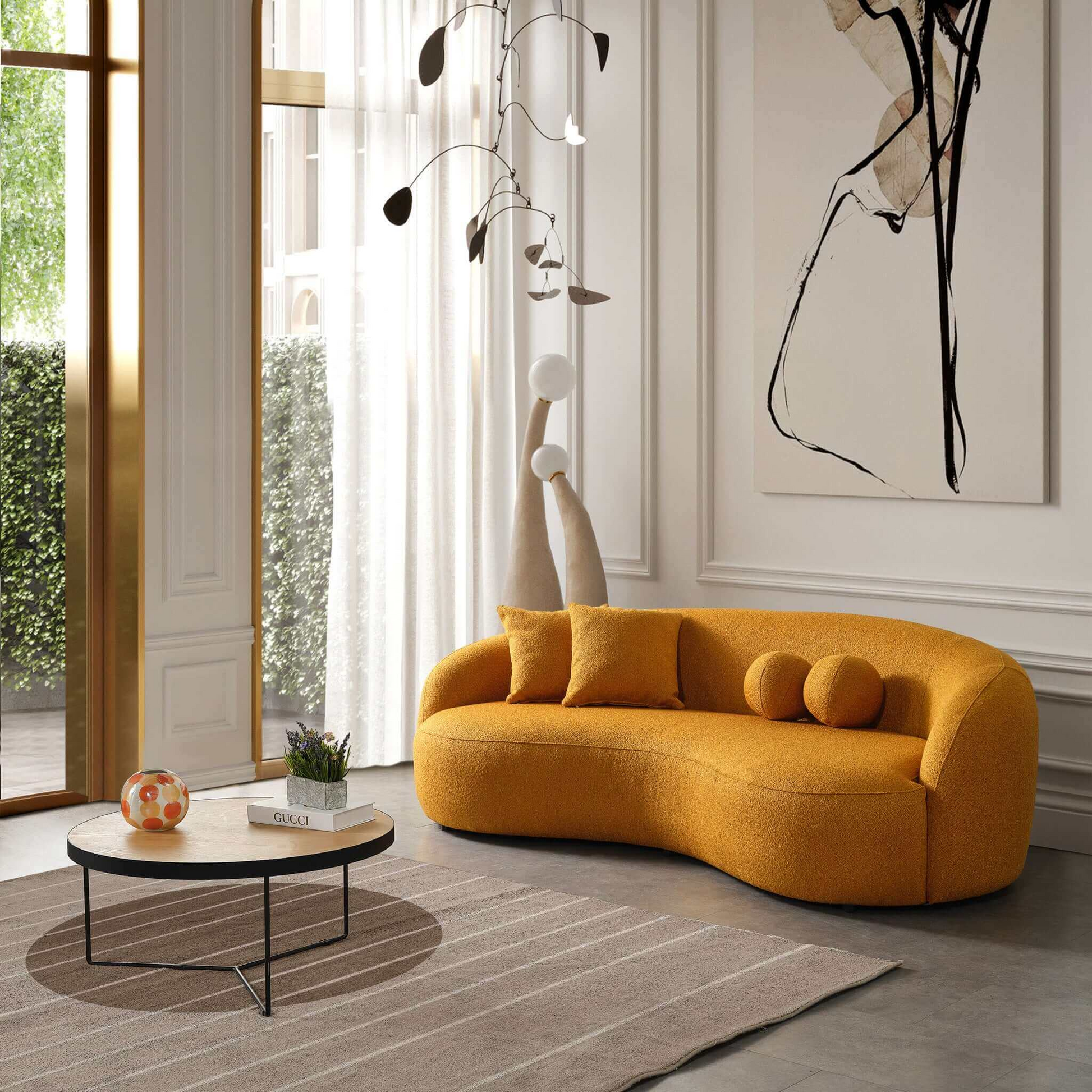 Upholstered mustard yellow curved sofa with boucle fabric and plush cushions