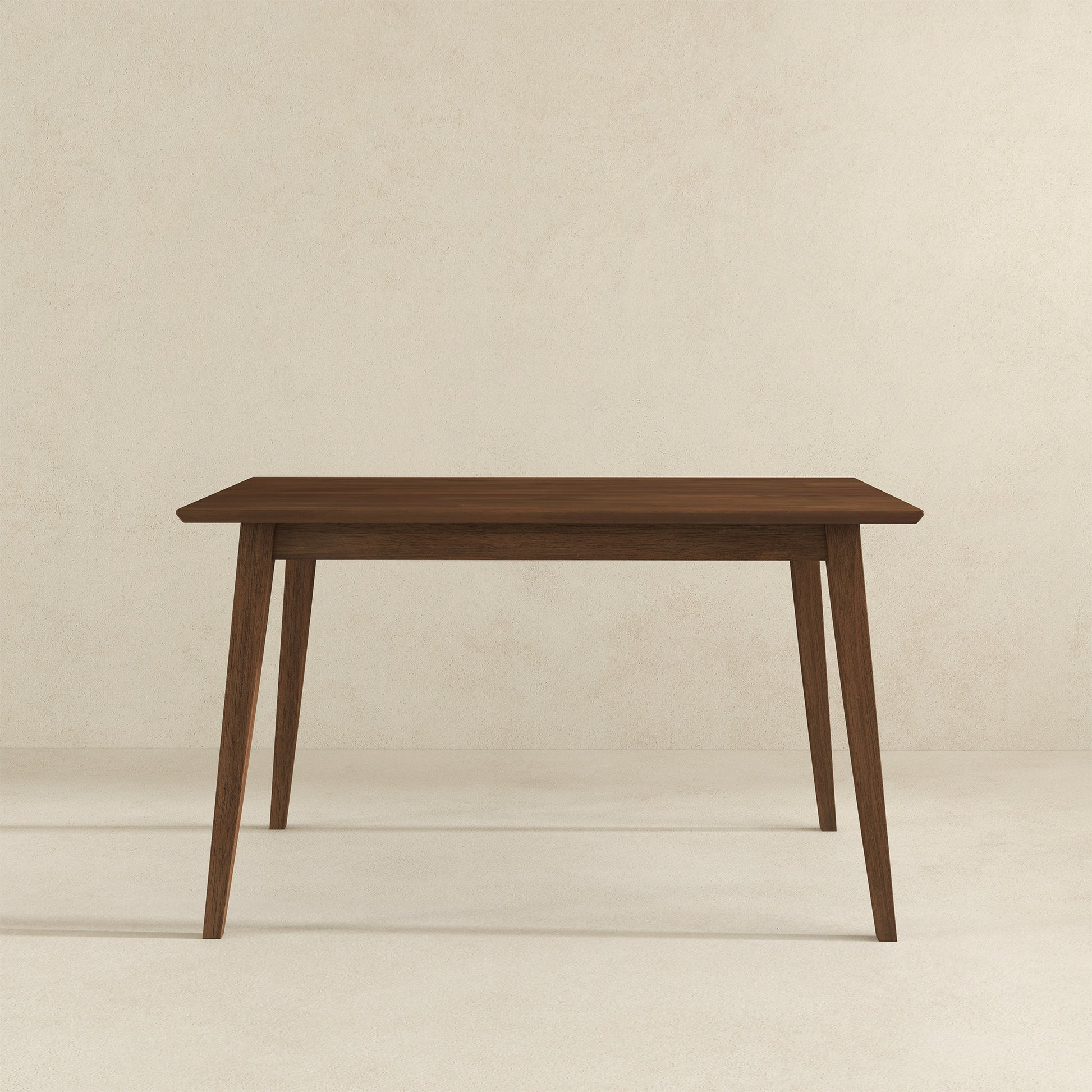 Dark wood dining table with tapered legs midcentury modern style