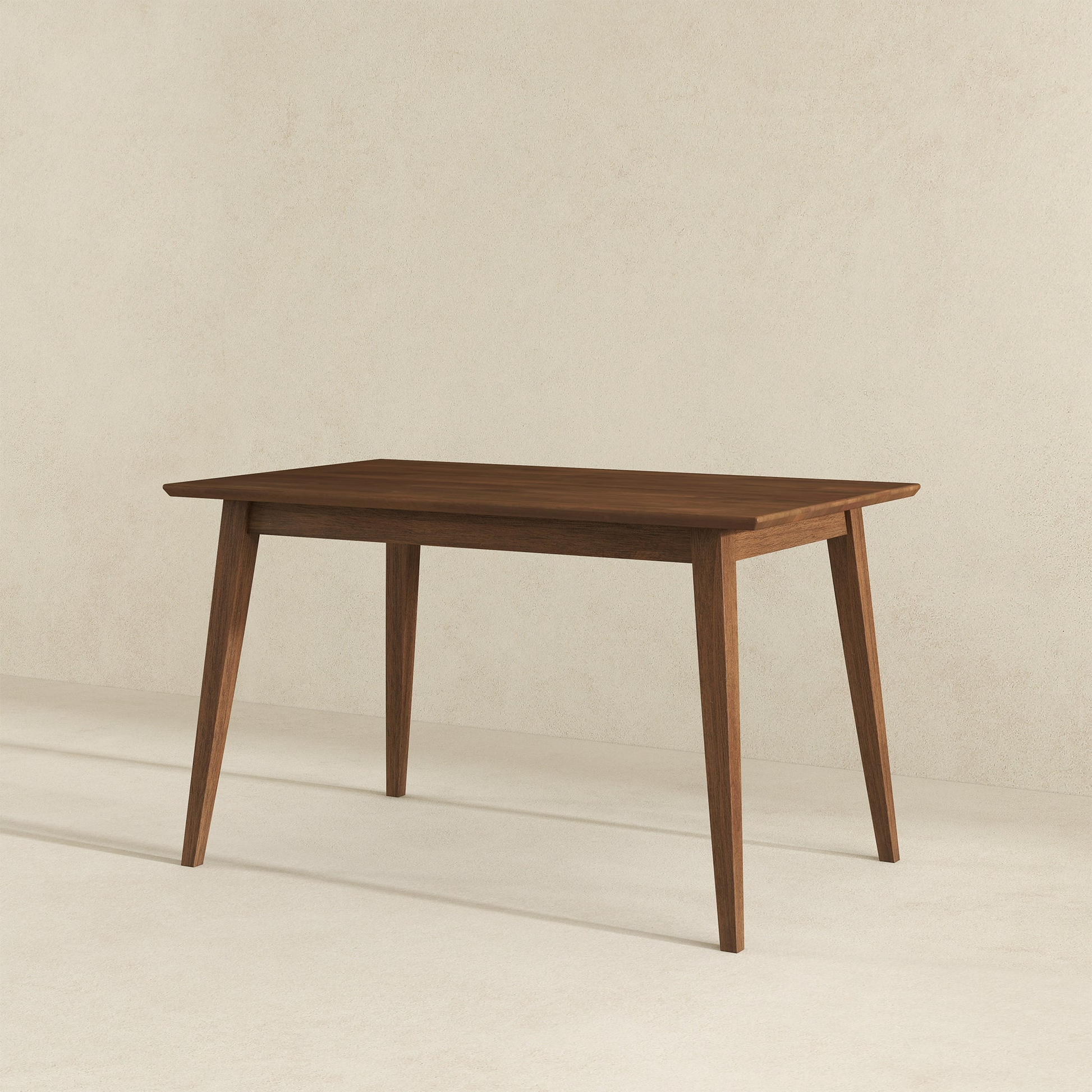 Midcentury modern walnut dining table with tapered legs perfect for small spaces