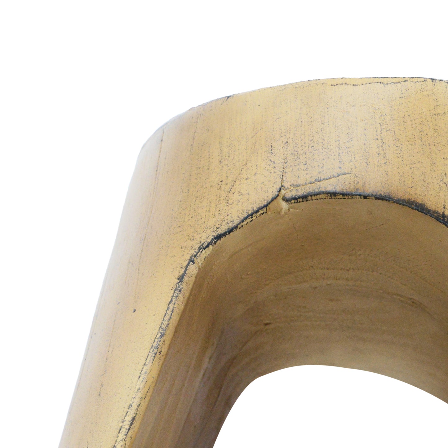 Close up of a textured gold abstract sculpture with distressed details