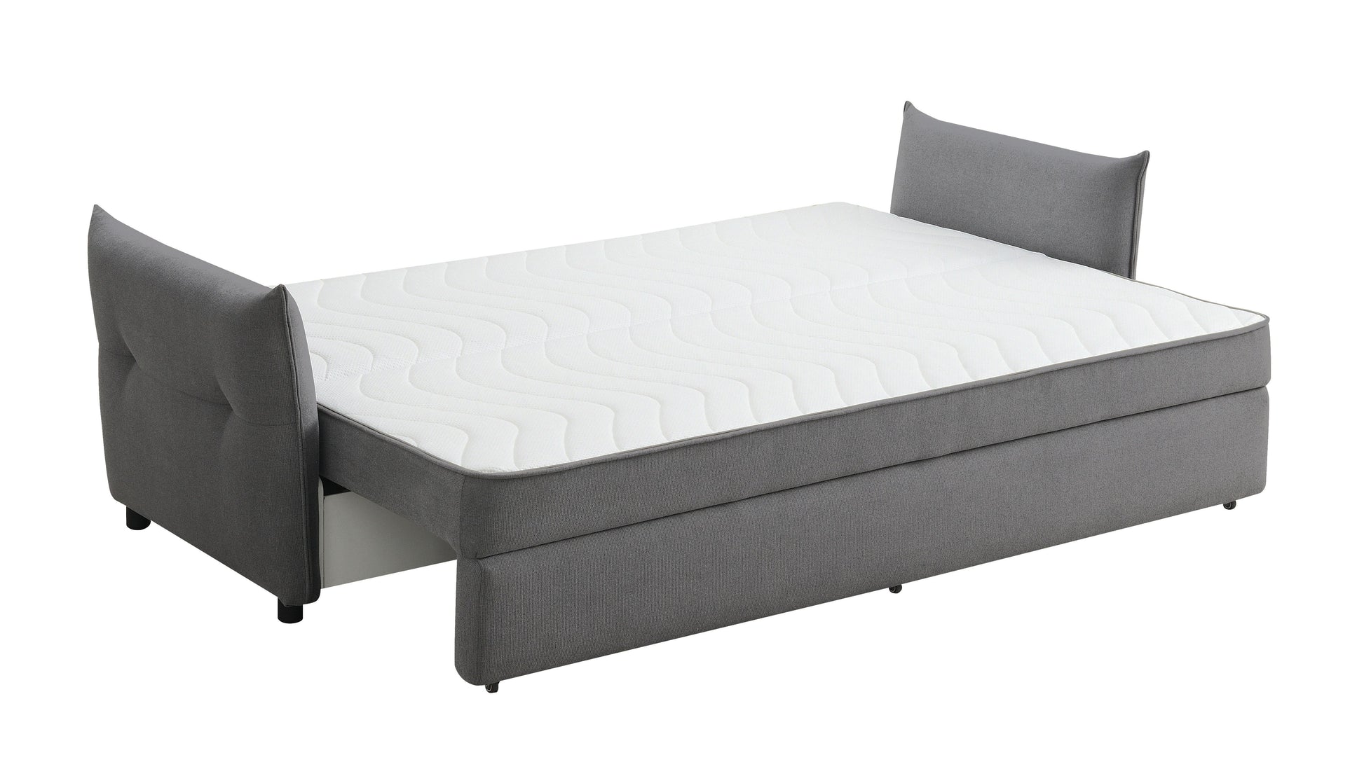 Grey upholstered sofa bed with a plush mattress and tufted headboards perfect for guest rooms