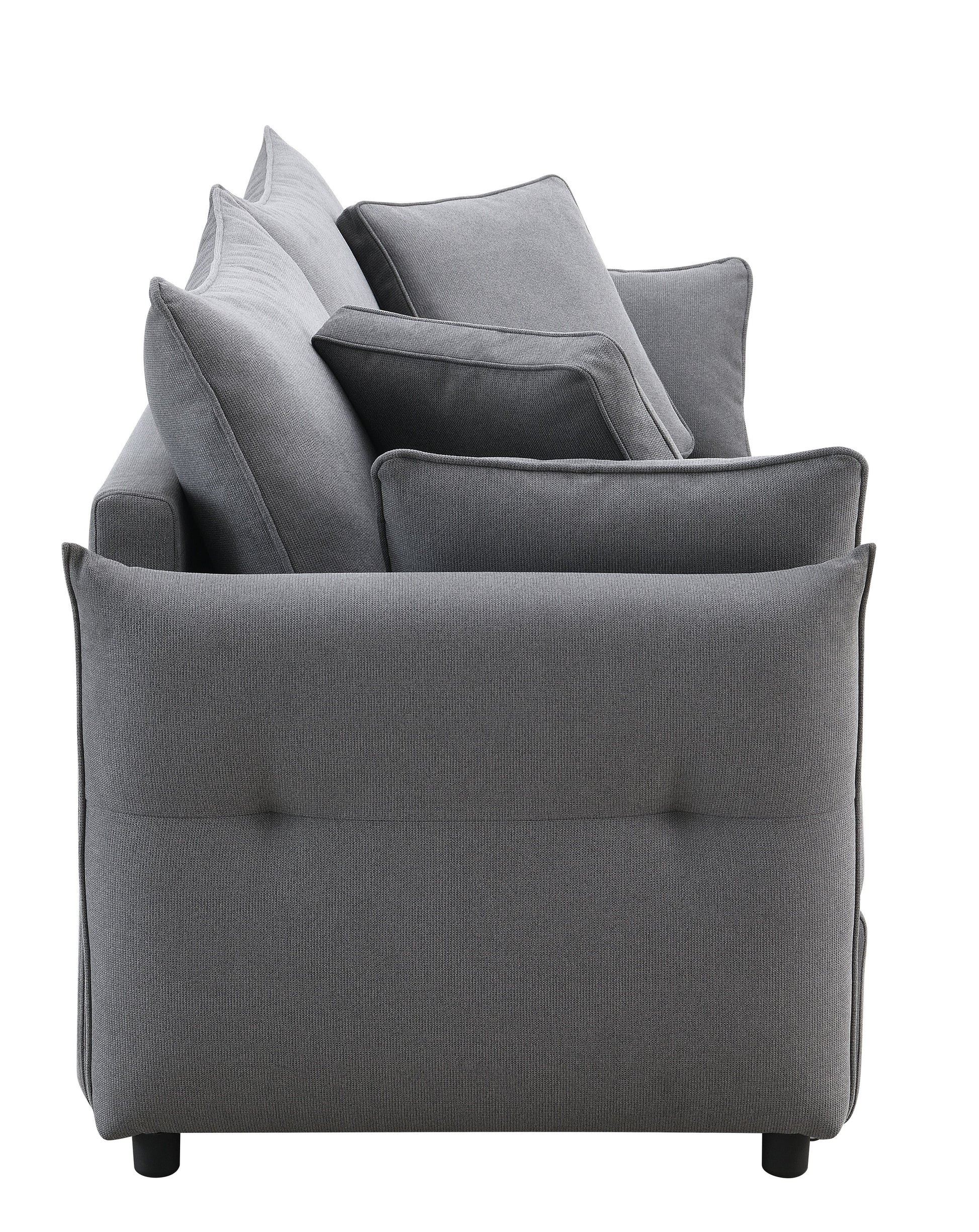 Plush grey fabric sofa with deep seating and accent pillows modern living room furniture