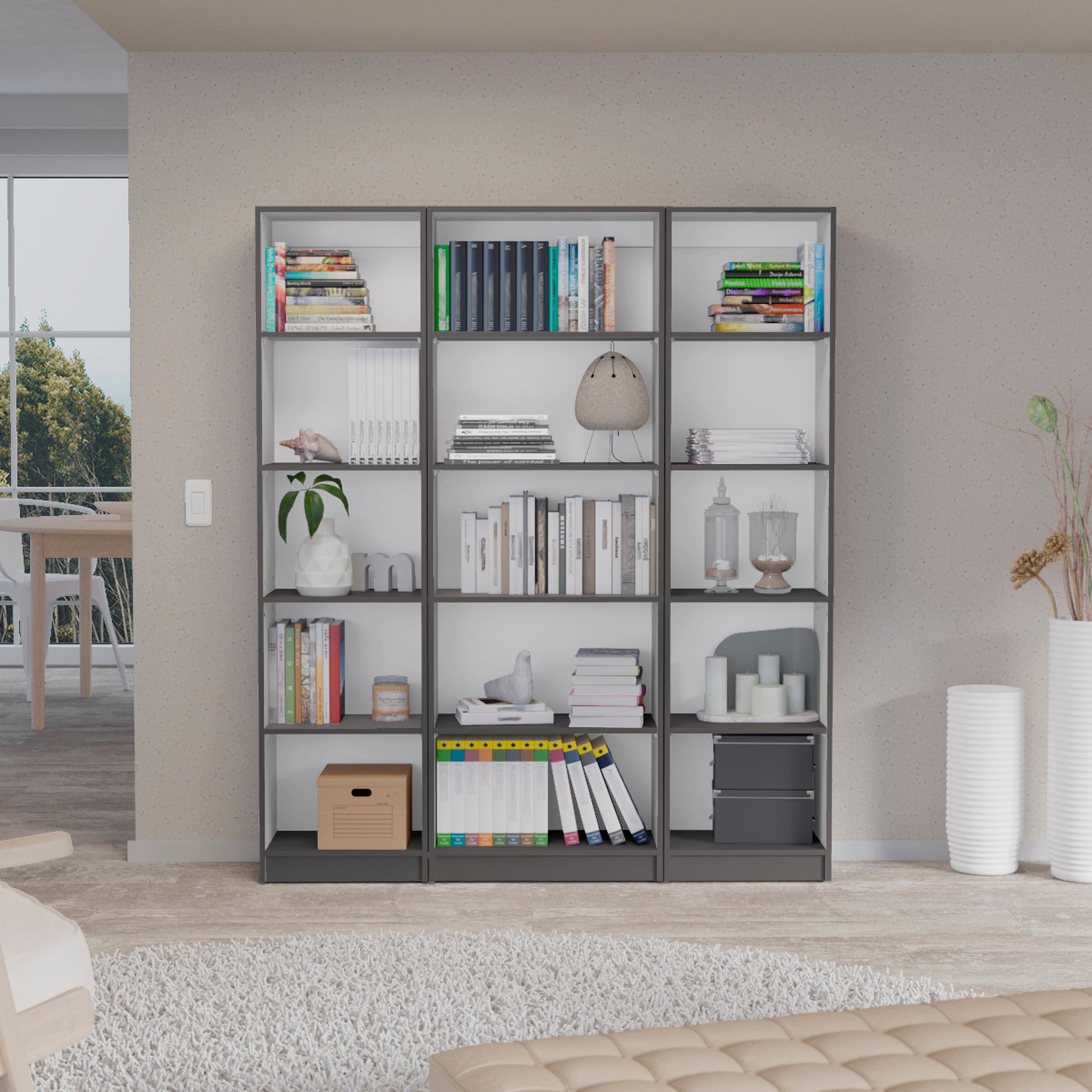 Modern gray modular bookshelf unit filled with books and decor