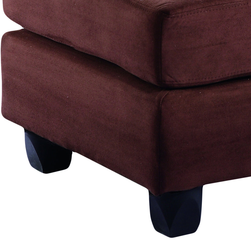 Rich brown microfiber ottoman with a plush top and dark tapered legs