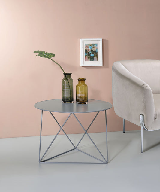 Modern grey metal accent table with geometric base perfect for small spaces