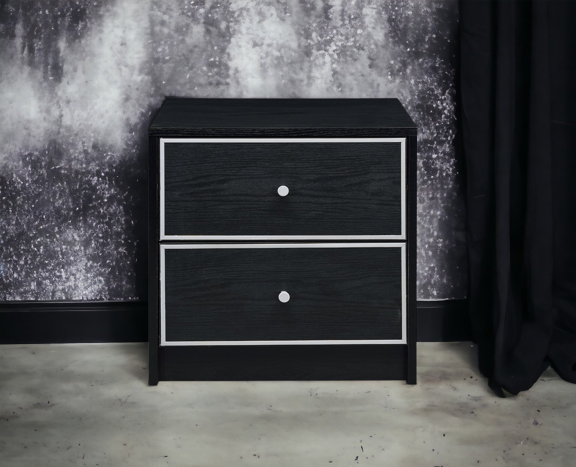 Black twodrawer nightstand with silver knobs and white trim detail