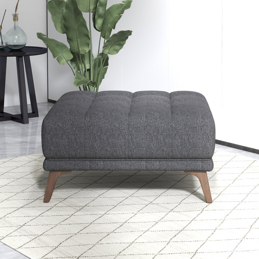 Tufted grey fabric ottoman with angled wooden legs perfect for living room seating