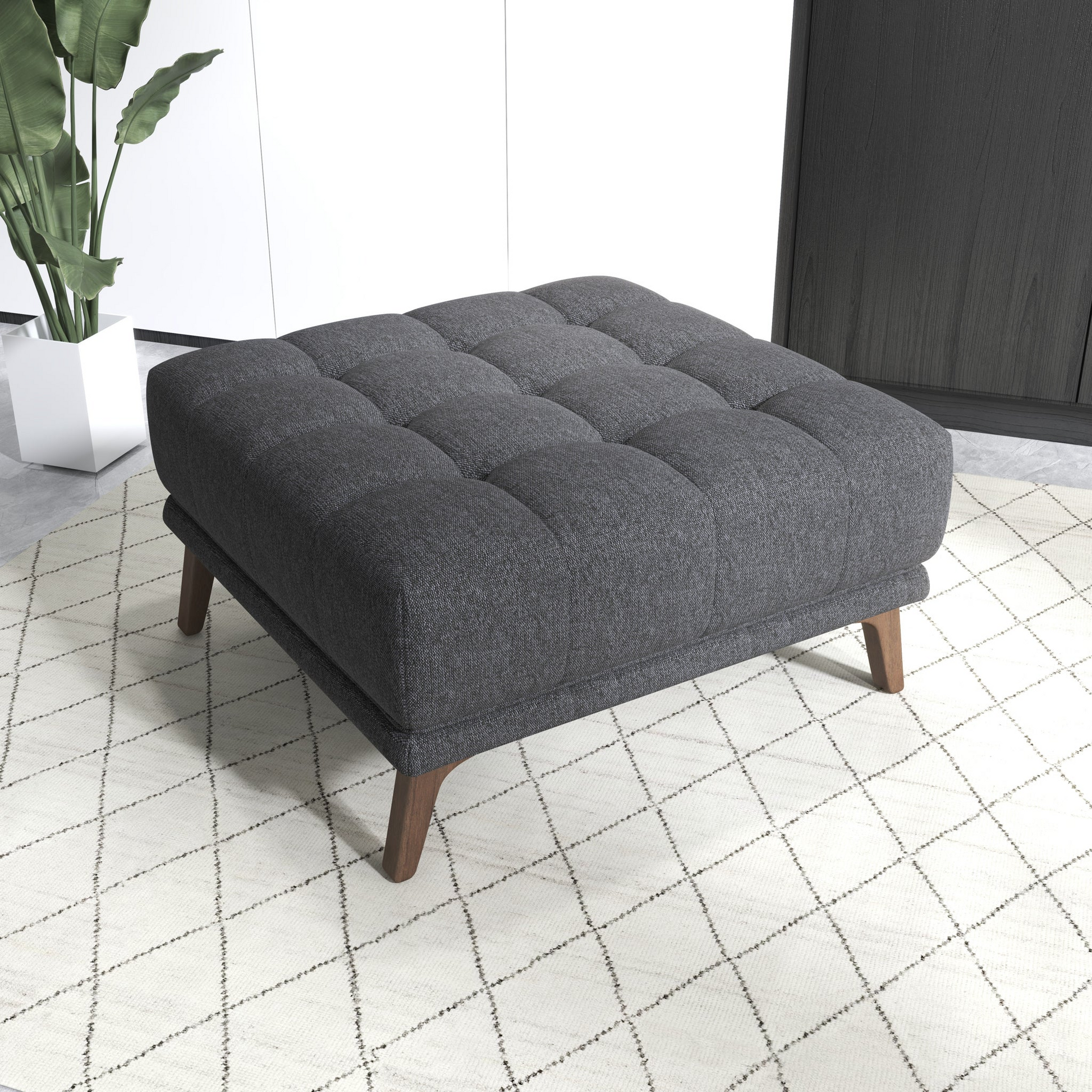 Dark gray tufted ottoman with wooden legs ideal for living room seating