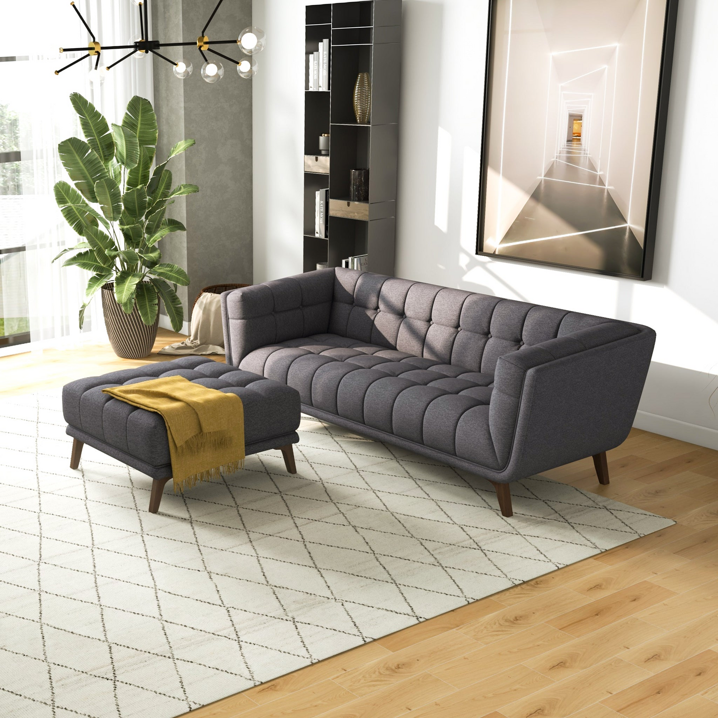 Dark grey tufted fabric sofa with midcentury modern wooden legs and diamond pattern rug