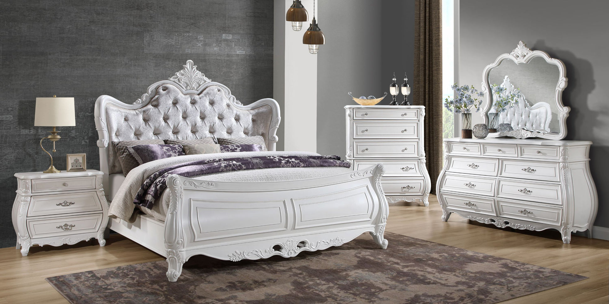 Ornate white sleigh bed with tufted headboard matching nightstand and dresser
