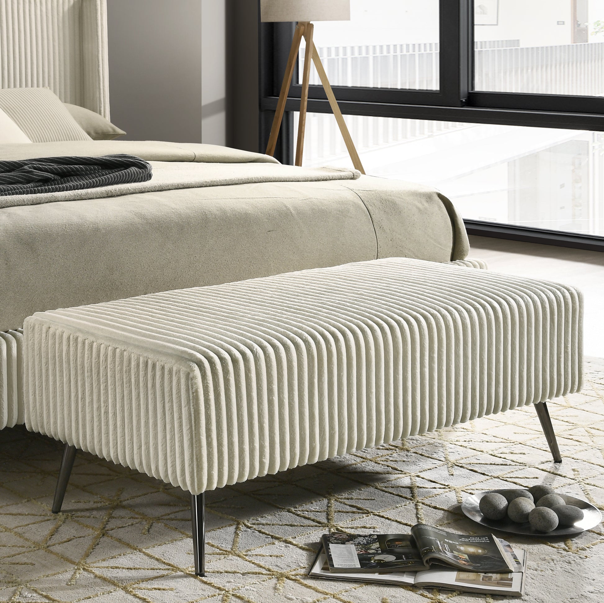 Plush cream upholstered bench with vertical ribbed texture and slim metal legs ideal accent seating