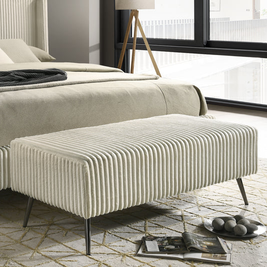 Plush cream upholstered bench with vertical ribbed texture and slim metal legs ideal accent seating