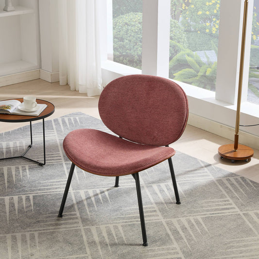 Dusty rose fabric accent chair with curved back and black metal legs
