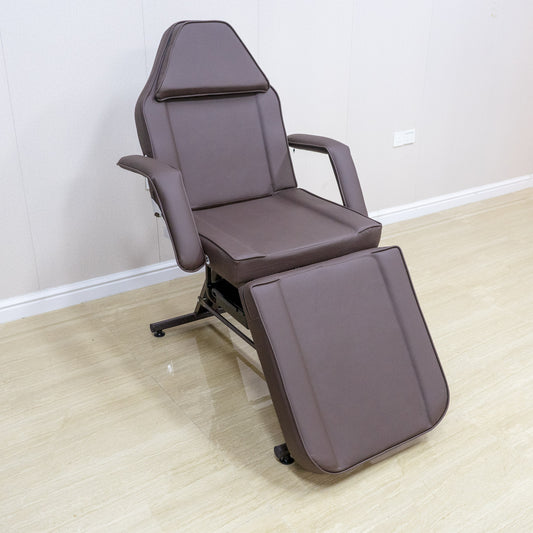 Brown adjustable spa chair with headrest and leg rest for massage treatments