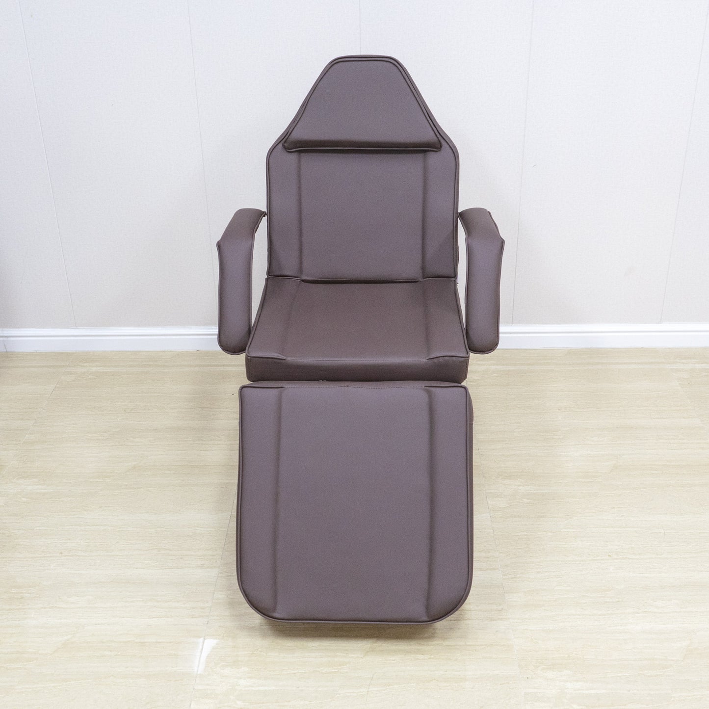Dark brown faux leather reclining salon chair with adjustable footrest and headrest