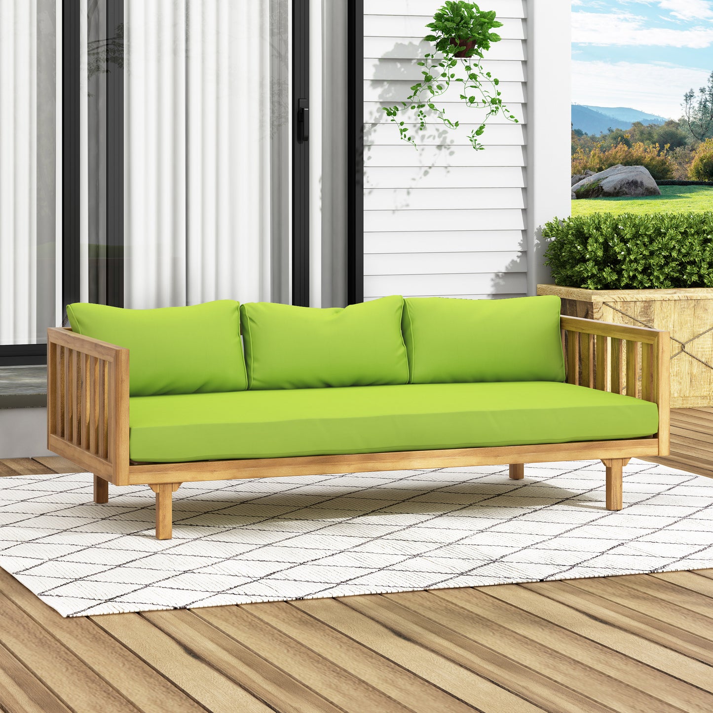 Wooden outdoor sofa with bright lime green cushions and a diamond pattern rug