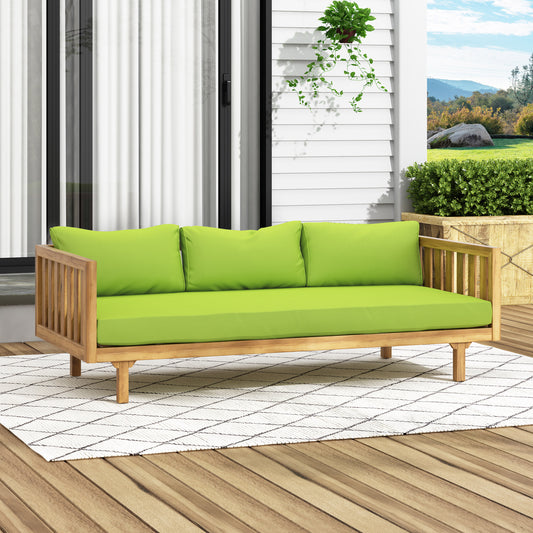 Wooden outdoor sofa with bright lime green cushions and a diamond pattern rug