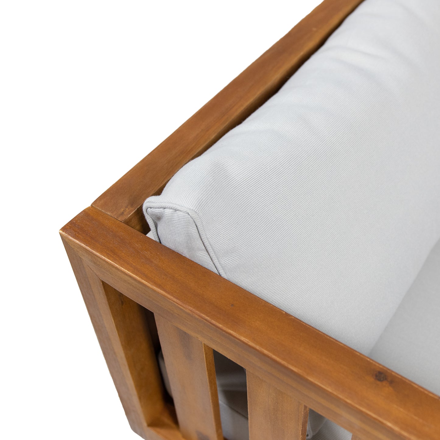 Closeup of wooden outdoor chair frame with light grey cushion