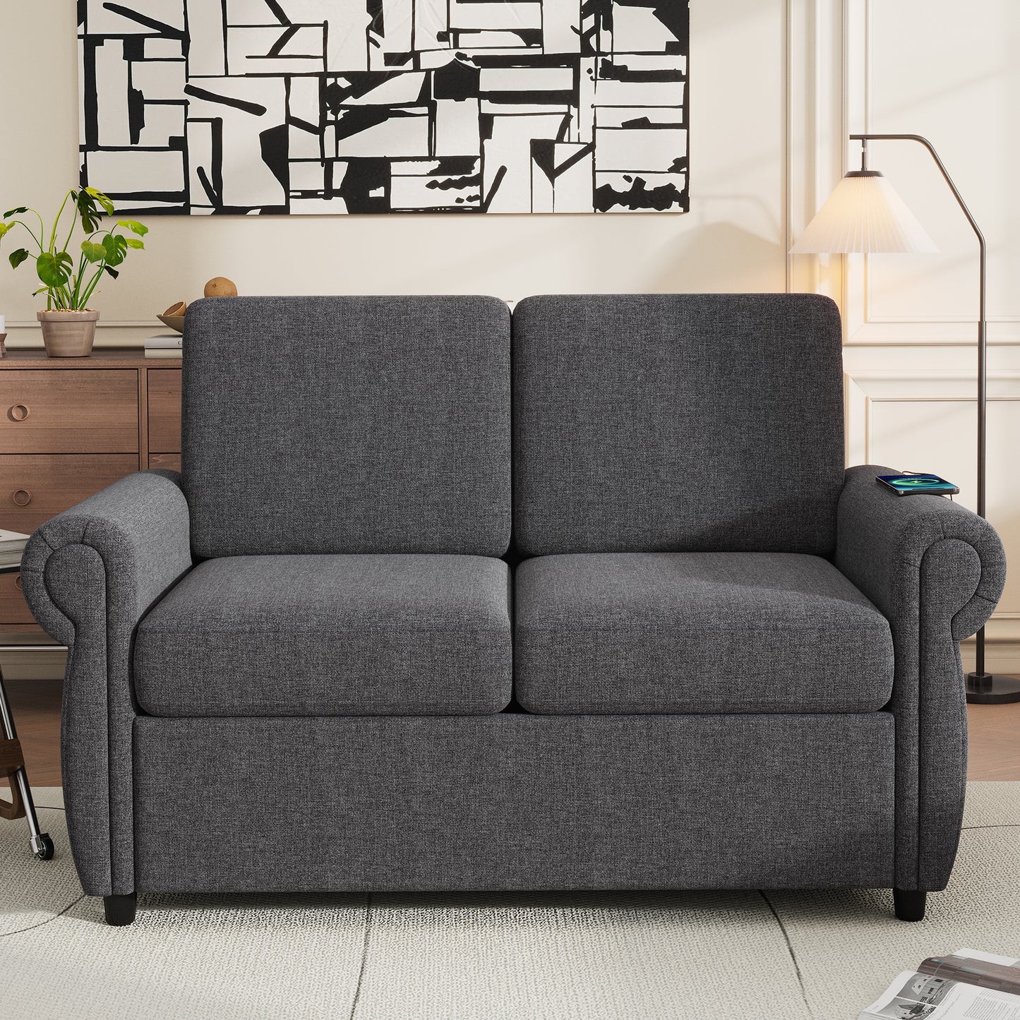 Dark grey fabric sofa with rolled arms featuring a modern design
