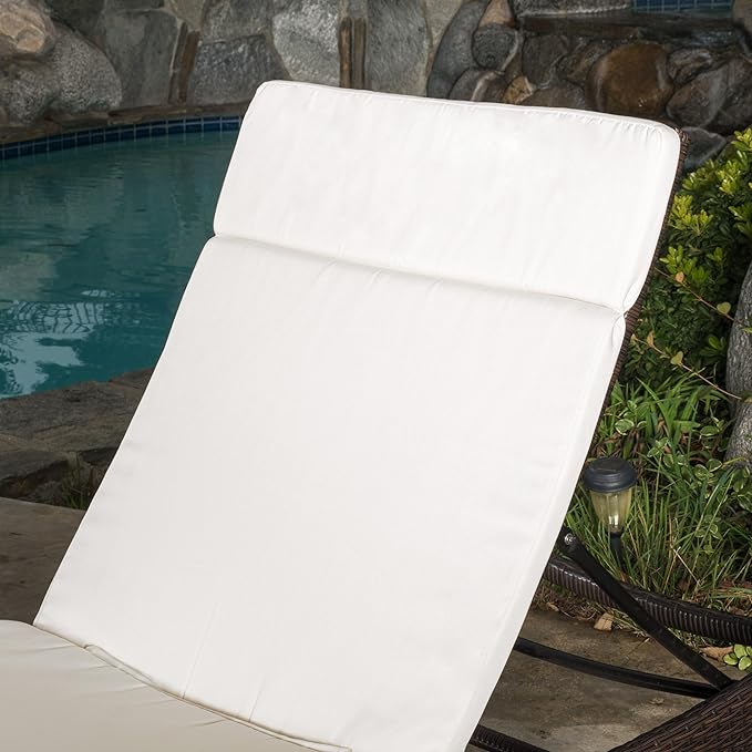 White tufted chaise lounge cushion for outdoor relaxation