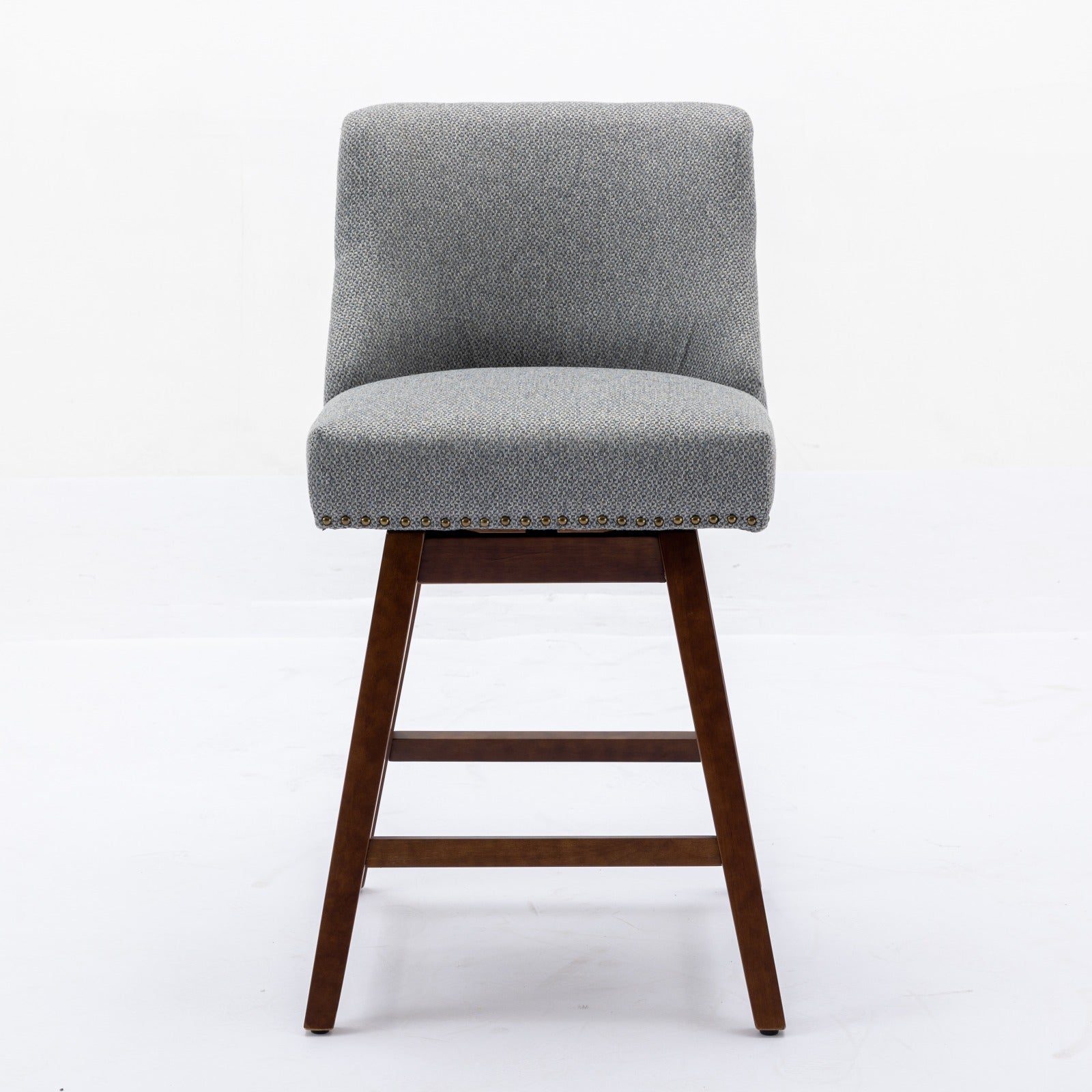 Grey upholstered swivel bar stool with nailhead trim and dark wood legs