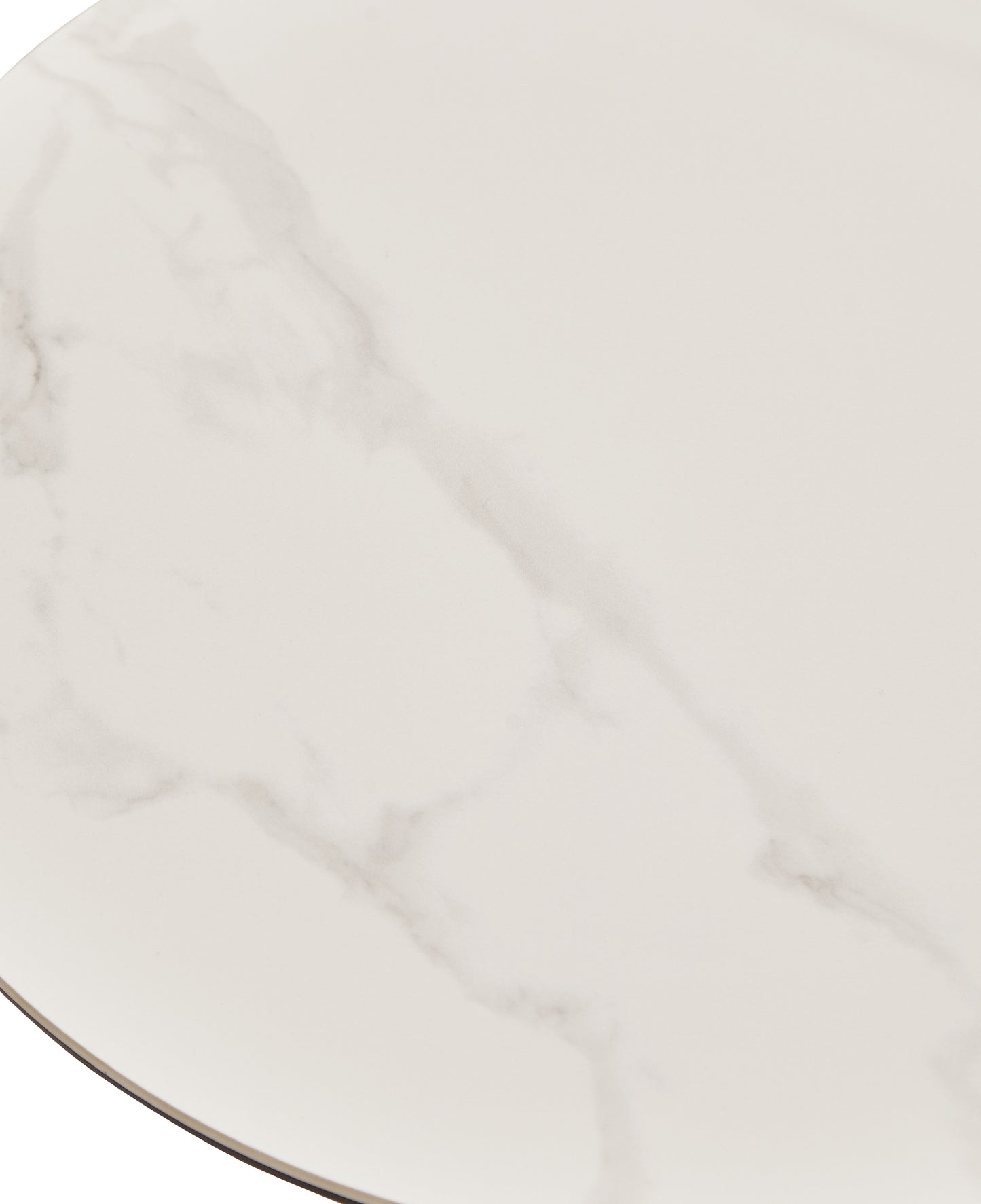 Closeup of a round white marblelook table top with subtle grey veining