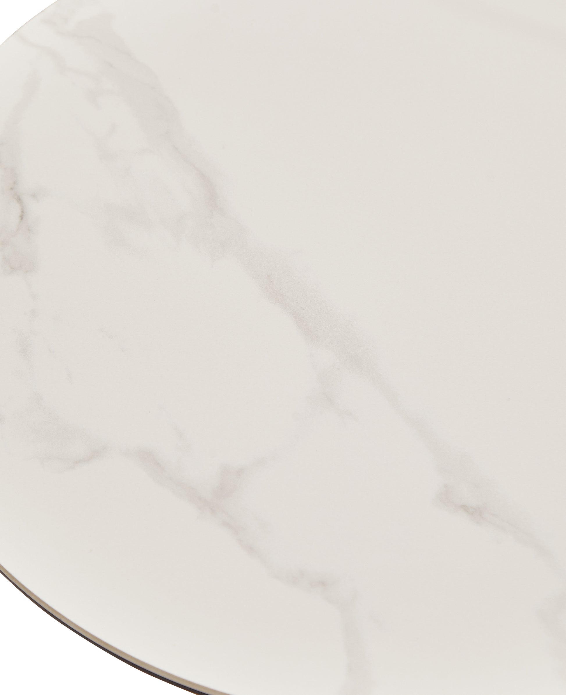 Closeup of a round white marblelook table top with subtle grey veining