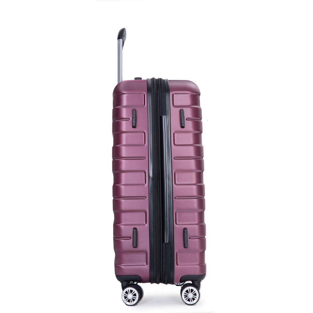 Purple hardside suitcase with textured finish and spinner wheels ready for travel