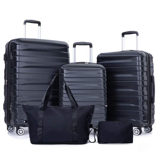 Four black hardside luggage pieces with a duffel bag and pouch