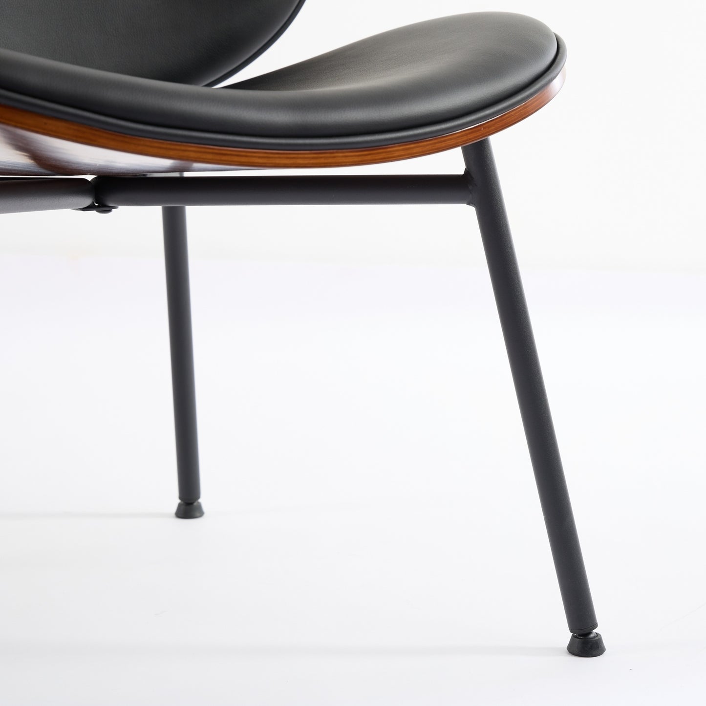 Black leather and wood accent chair with minimalist metal legs