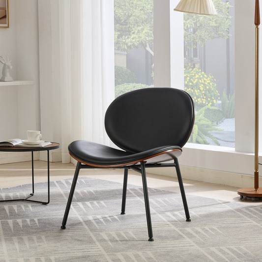 Black faux leather accent chair with curved wood and metal frame for modern living room
