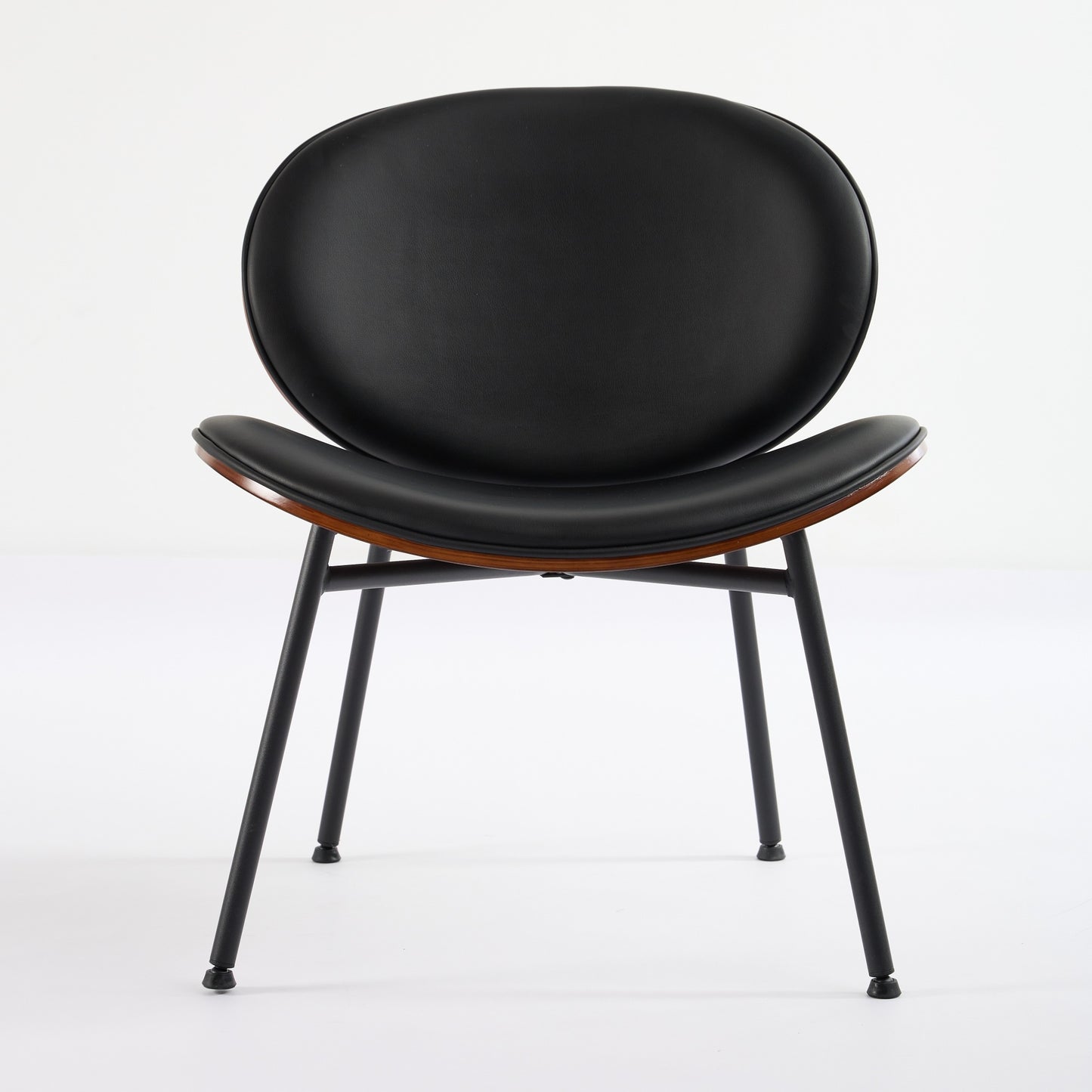Black leather dining chair with curved wood accent and black metal legs