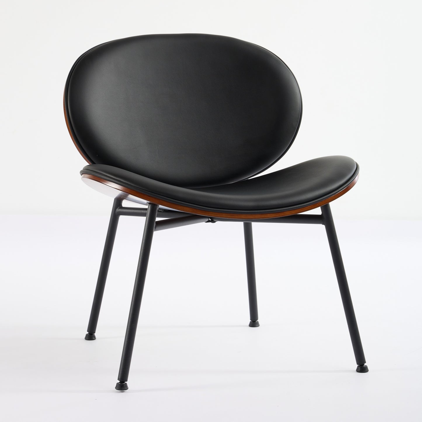 Black leather molded chair with wooden trim and matte black metal legs for modern living spaces